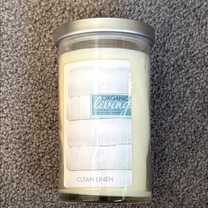 Clean Linen Candle by Organic Living - Creamy White. 18 oz. Includes wick clip.